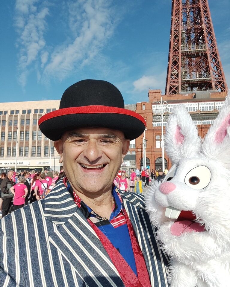 Barney Baloney with his white rabbit puppet in Blackpool